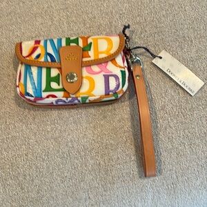 Dooney & Burke small wrist purse. New with tag and registration card